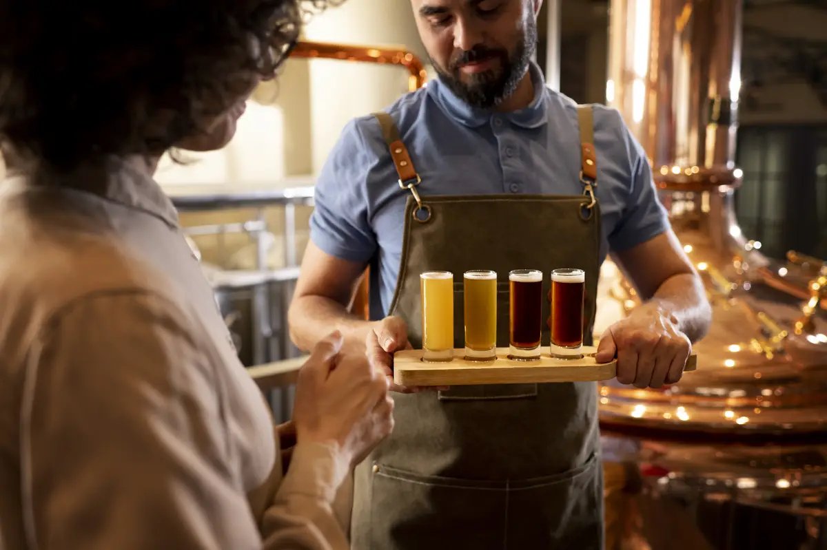 Side view people working in beer factory